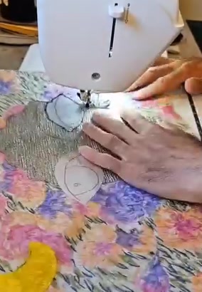 Aryan Abubakr's hands at the sewing machine in his Vancouver studio